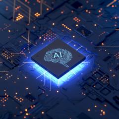Backlit computer chip labelled AI on circuit board
