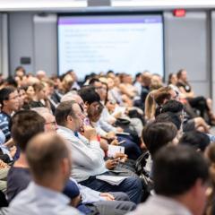 A speaker presenting to an audience